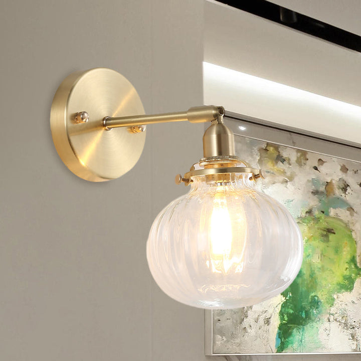 1 Head Wall Mounted Lamp Colonial Orb Clear/Cognac Prismatic Glass Sconce Lighting Fixture in Gold | Stornfield