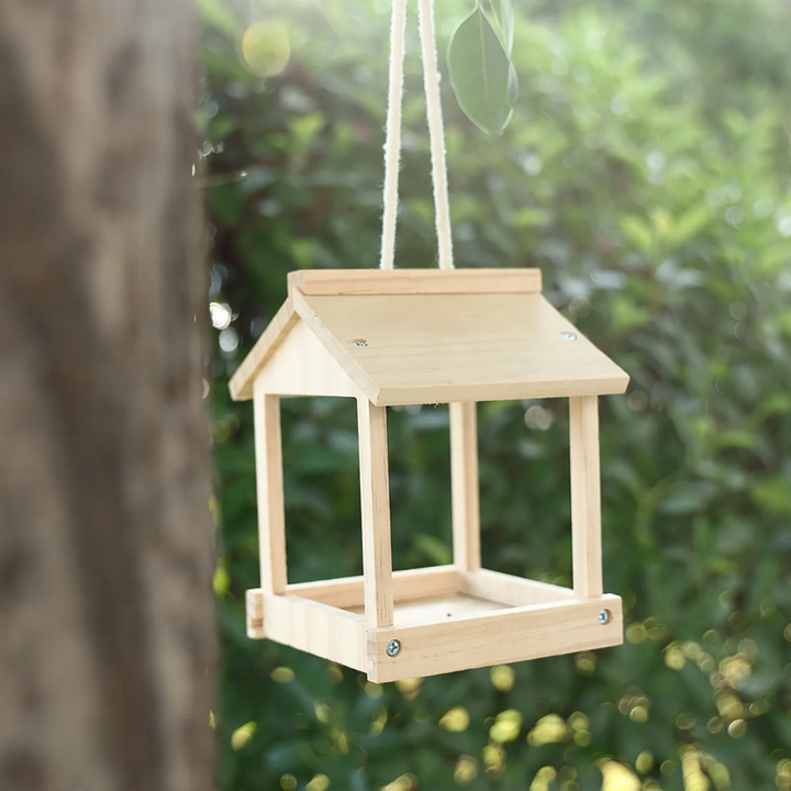 Hanging wooden birdhouse with feeding station