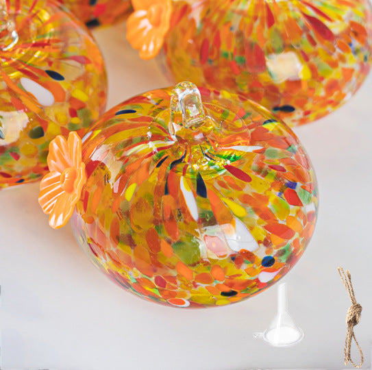 Hanging bird feeder and water station made of glass