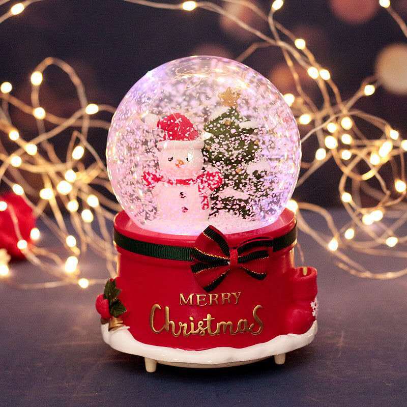 Illuminated snow globe music box with music