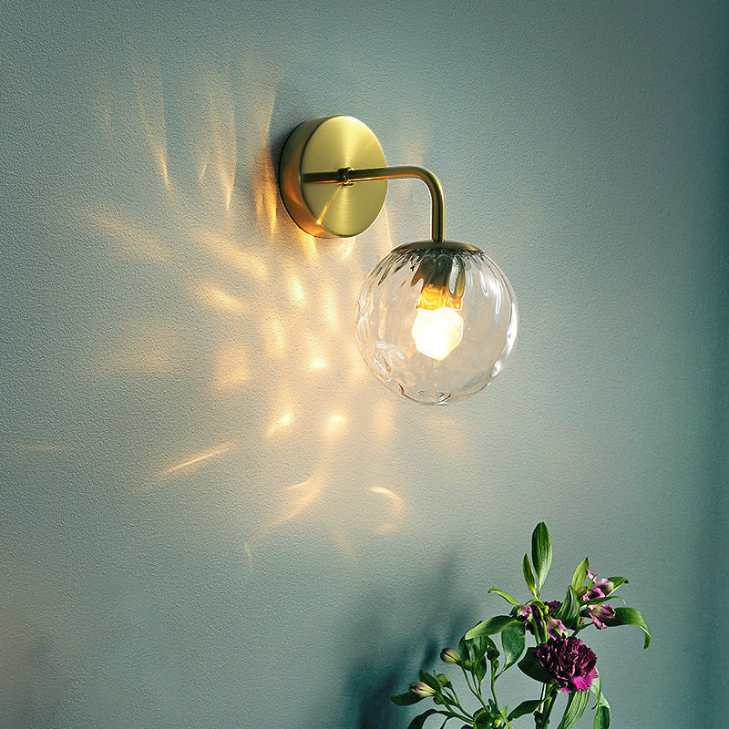 Ball Shaped Wall Lamp Minimalist Clear Rippling Glass 1-Light Bedroom Wall Mounted Lighting with Bent Arm in Black/Gold | Stornfield