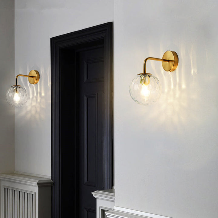 Ball Shaped Wall Lamp Minimalist Clear Rippling Glass 1-Light Bedroom Wall Mounted Lighting with Bent Arm in Black/Gold | Stornfield