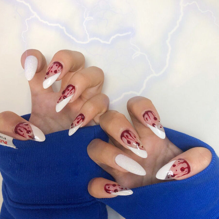 Artistic acrylic nails with elegant flower and glitter accents Stornfield