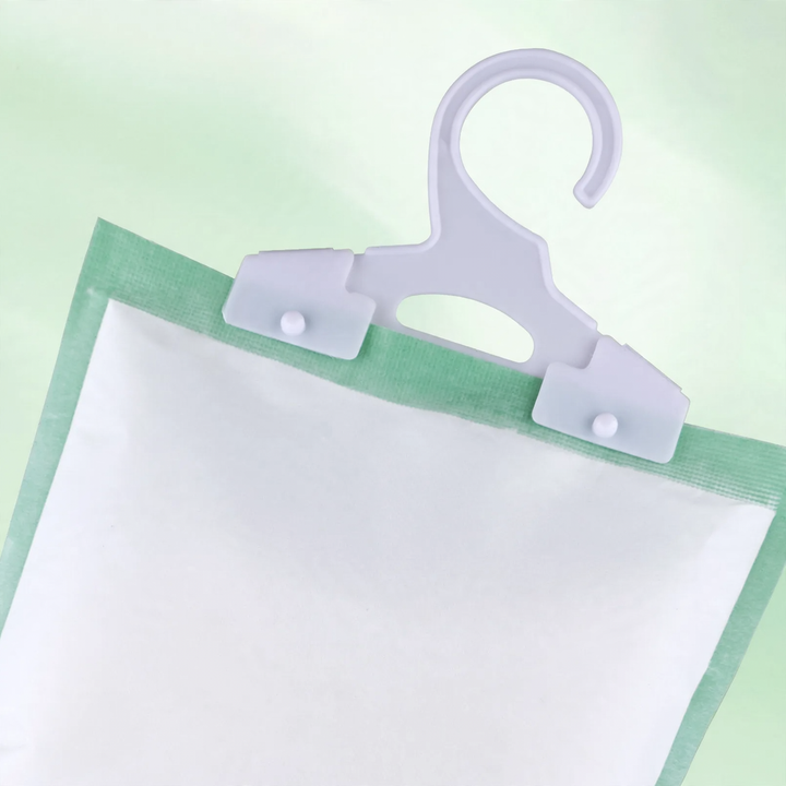 Hanging dehumidifying bag for wardrobes
