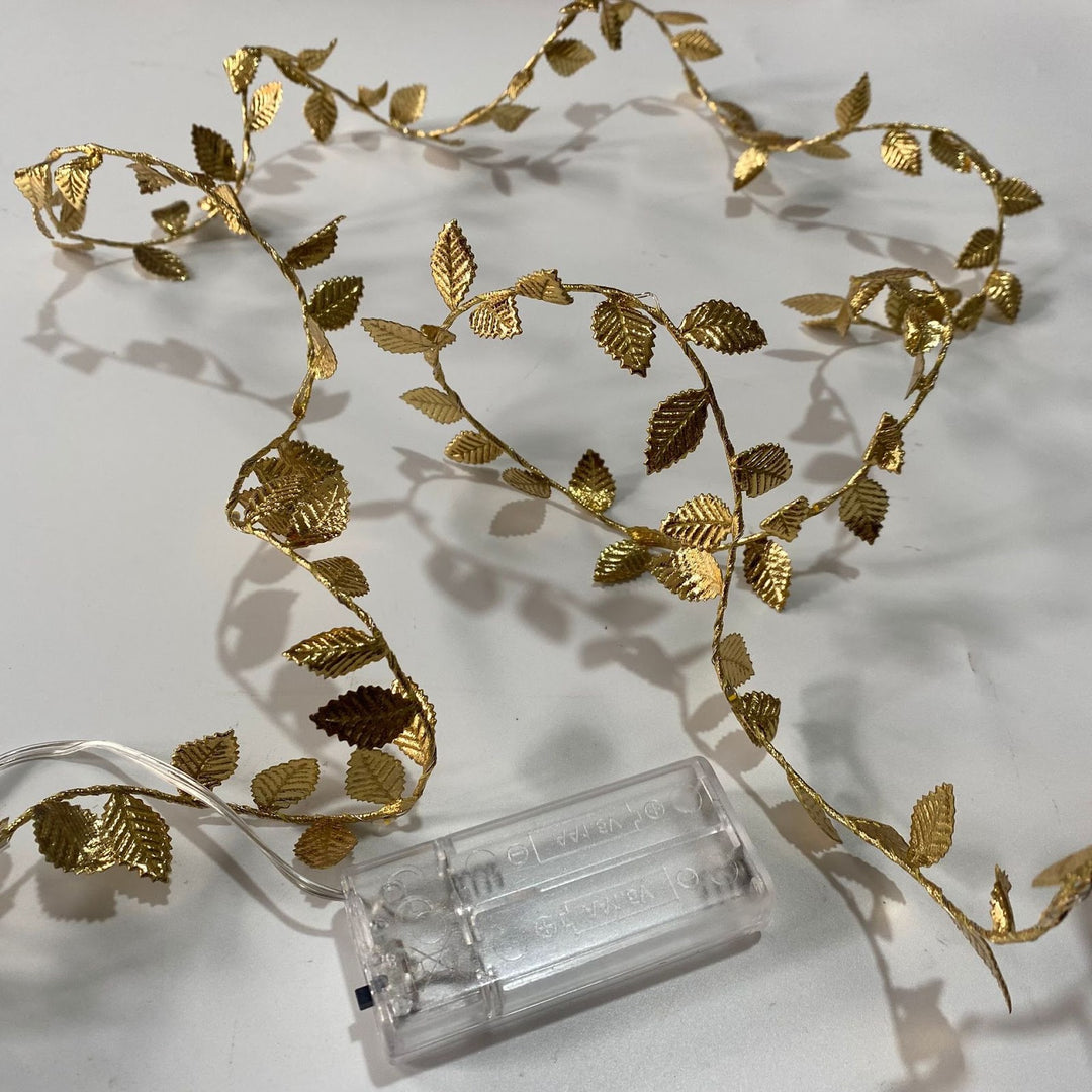 LED light chain with artificial leaves