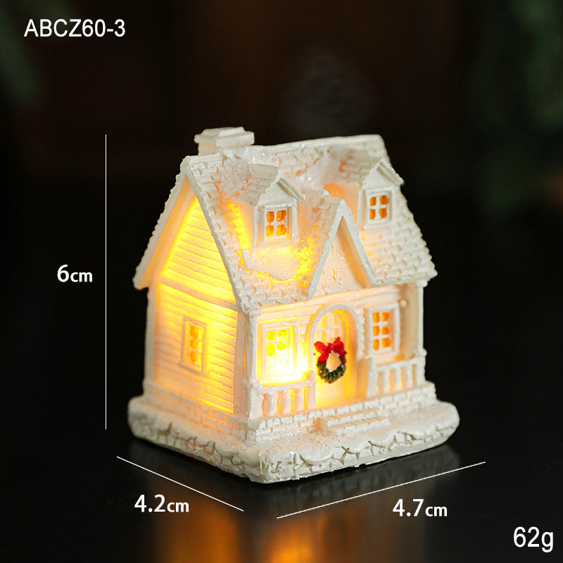 Illuminated miniature snow house made of resin