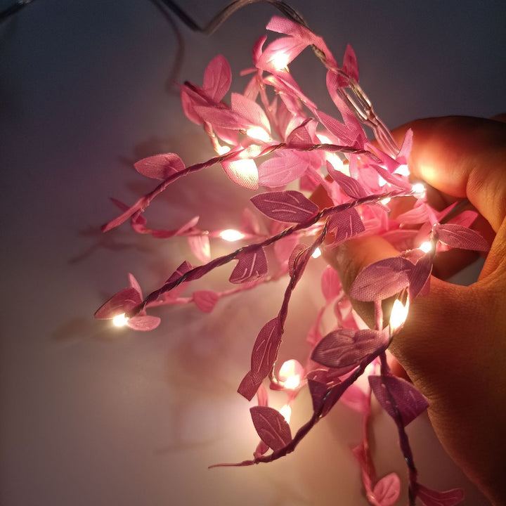 LED light chain with artificial leaves