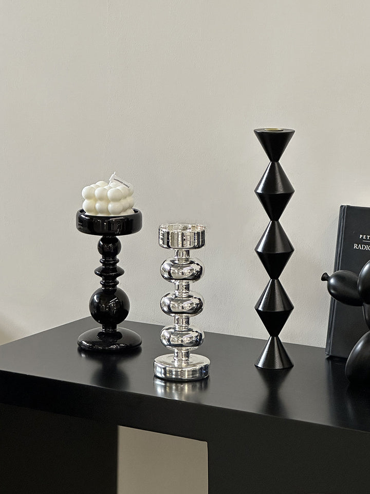 Decorative candle holder made of glass and wood