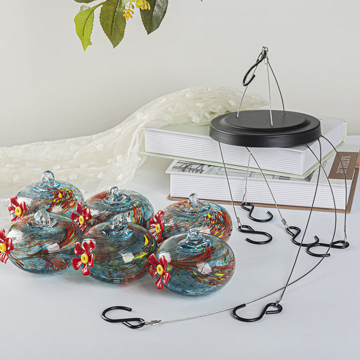Hanging bird feeder and water station made of glass