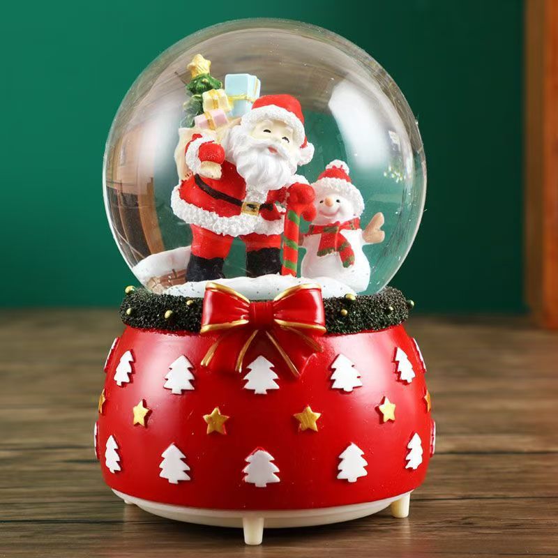 Illuminated snow globe music box with music