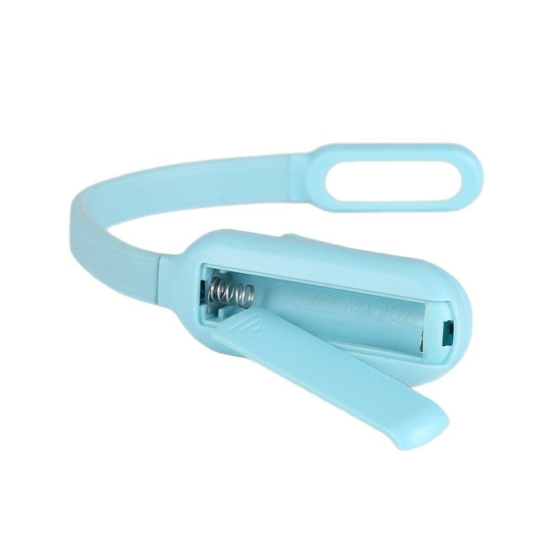 Mini LED clamp light with three brightness levels and USB charging