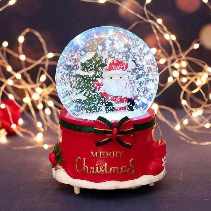 Illuminated snow globe music box with music