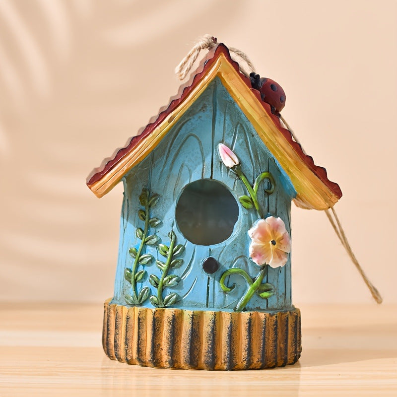 Decorative birdhouse made of resin for garden and balcony