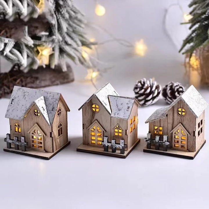 Illuminated wooden house for festive table decoration