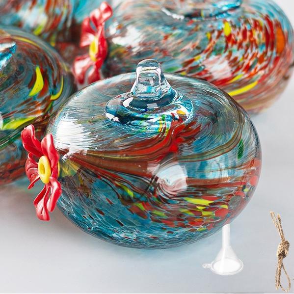 Hanging bird feeder and water station made of glass