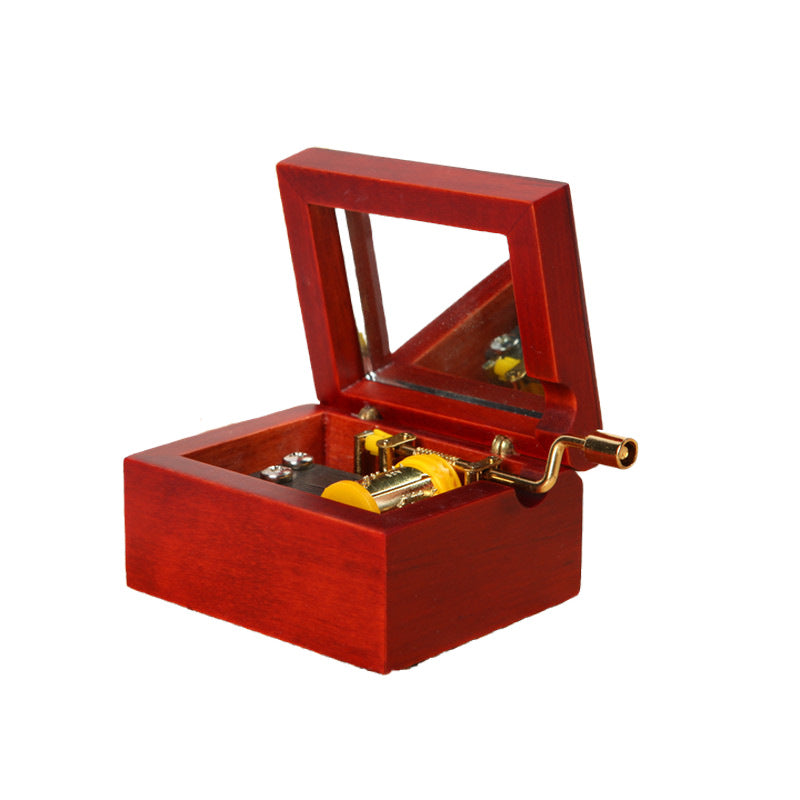 Wooden music box with hand crank