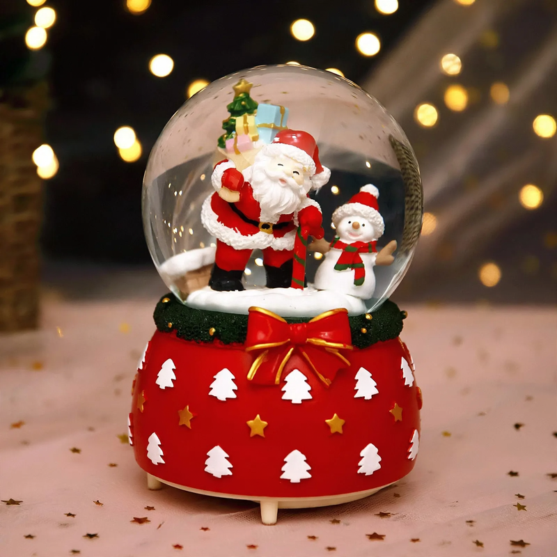 Illuminated snow globe music box with music