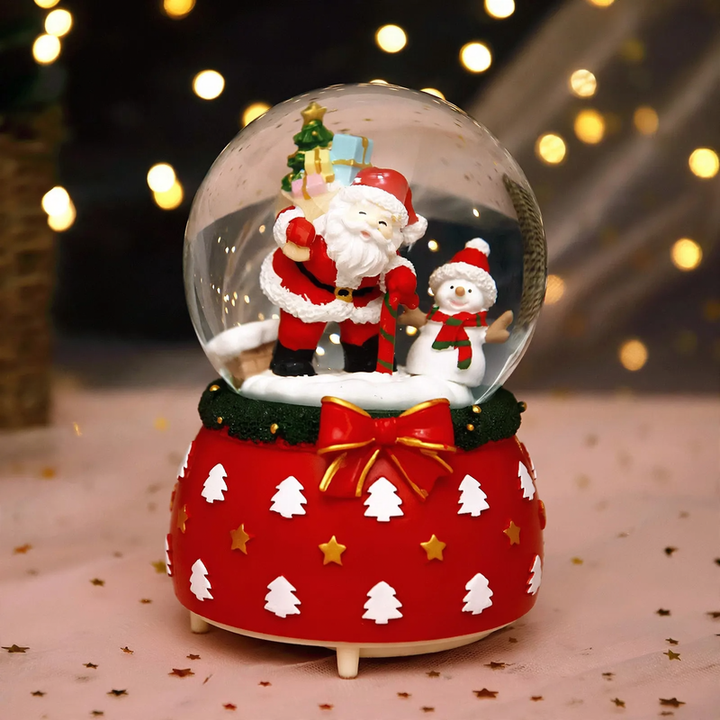 Illuminated snow globe music box with music