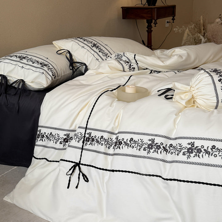 Elegant cotton bedding set with embroidery and bows