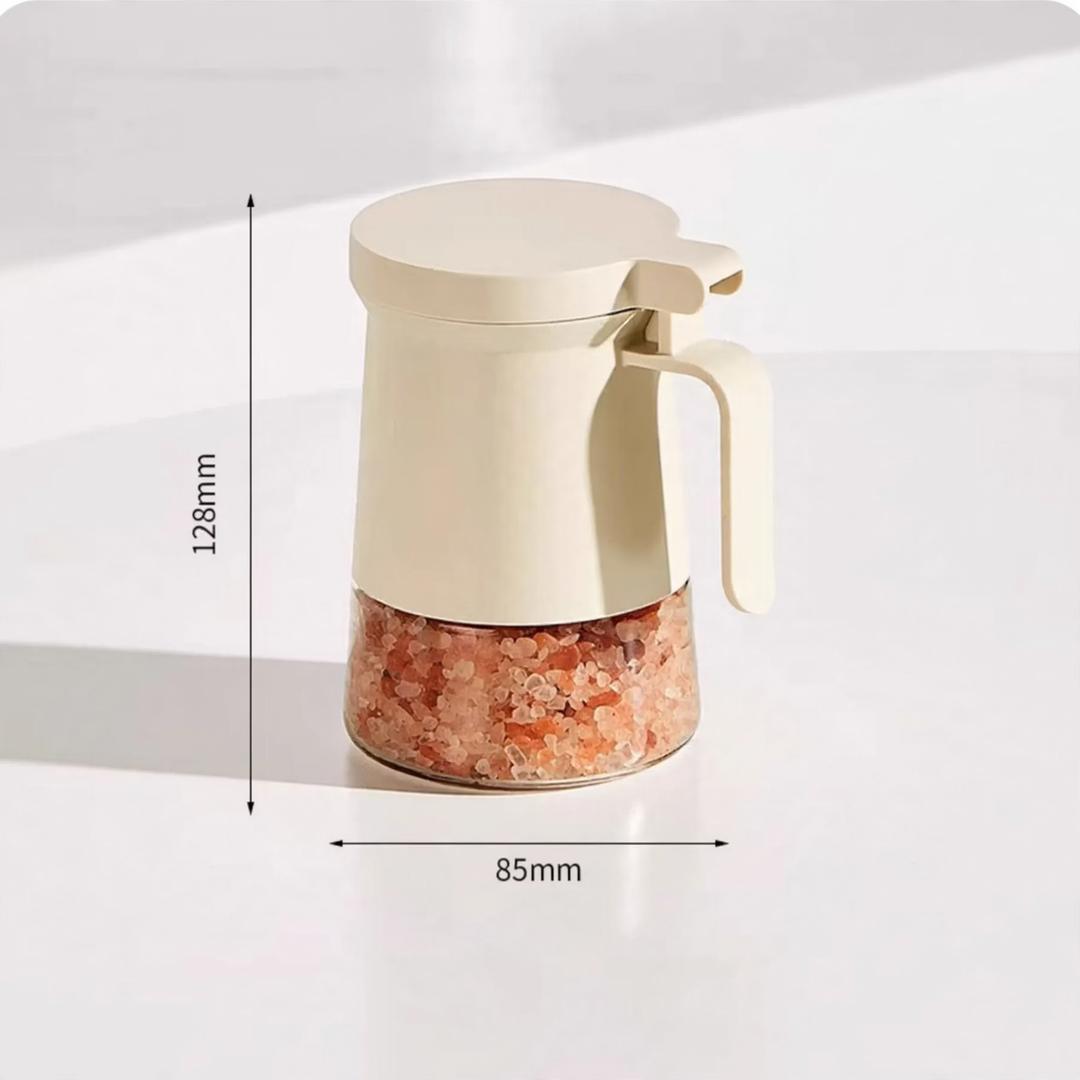 Sealed spice container made of glass with spoon