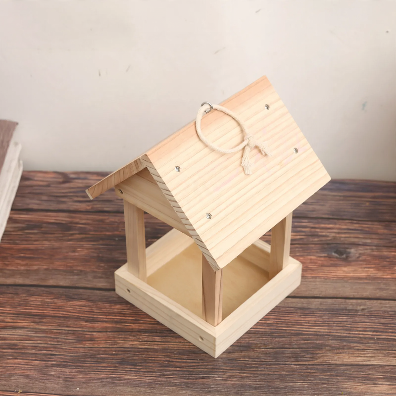 Open birdhouse made of wood as a feeding station