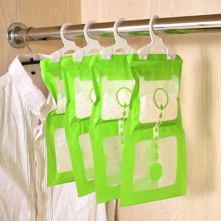 Hanging moisture absorber for cabinets