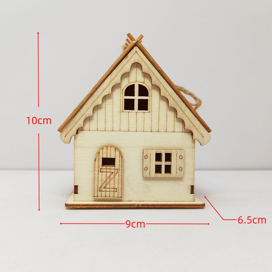Illuminated wooden house for Christmas decoration