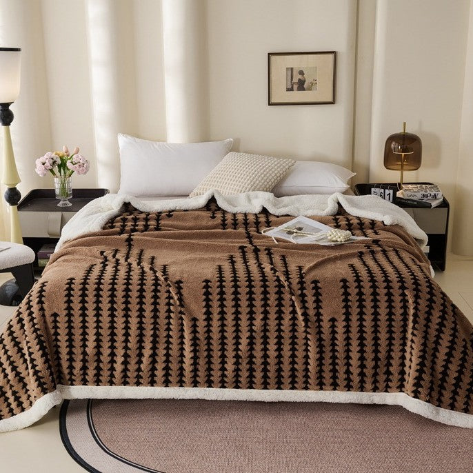 Double-layered throw blanket with lamb fleece look