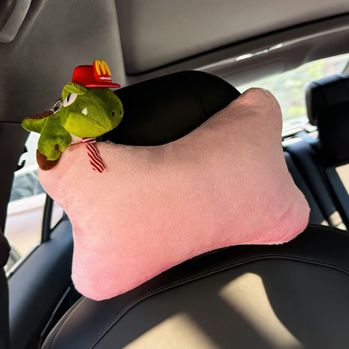 Car headrest with dinosaur design