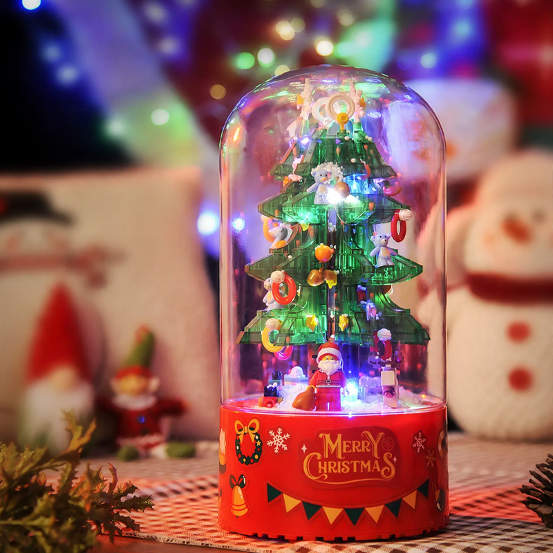 Rotating music box with light and snowfall