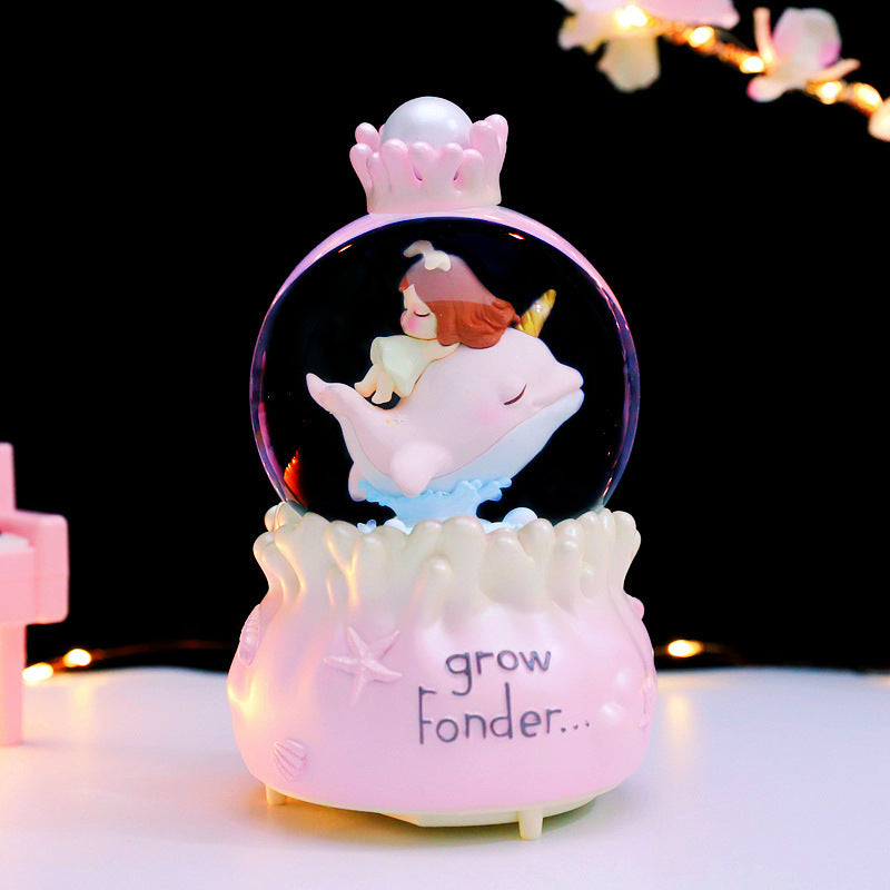 Fairy-tale snow globe with music and light