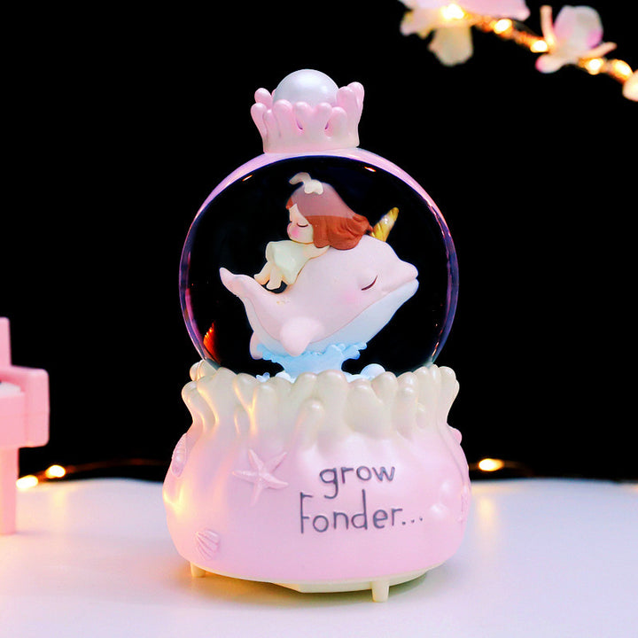 Fairy-tale snow globe with music and light