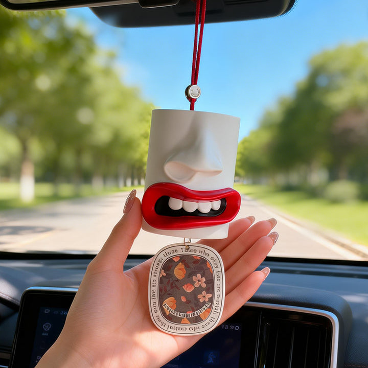 Car fragrance hanger with abstract lip design