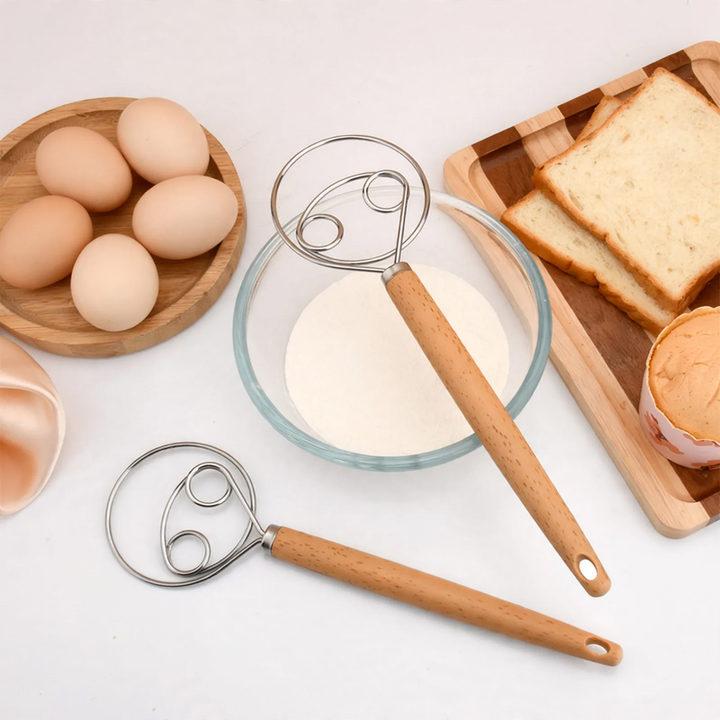 Hand-held device for kneading dough made of stainless steel