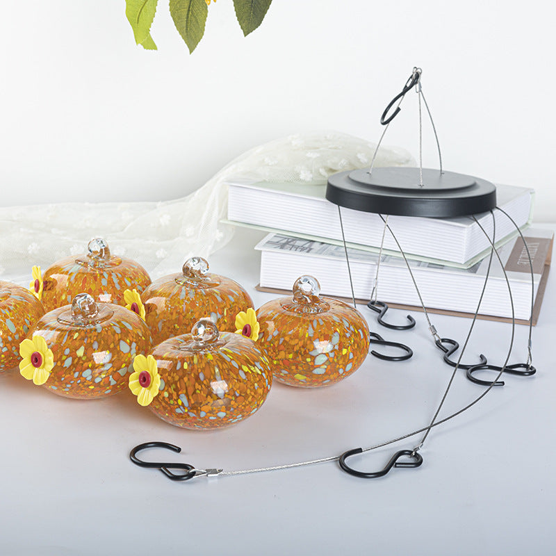Hanging bird feeder and water station made of glass