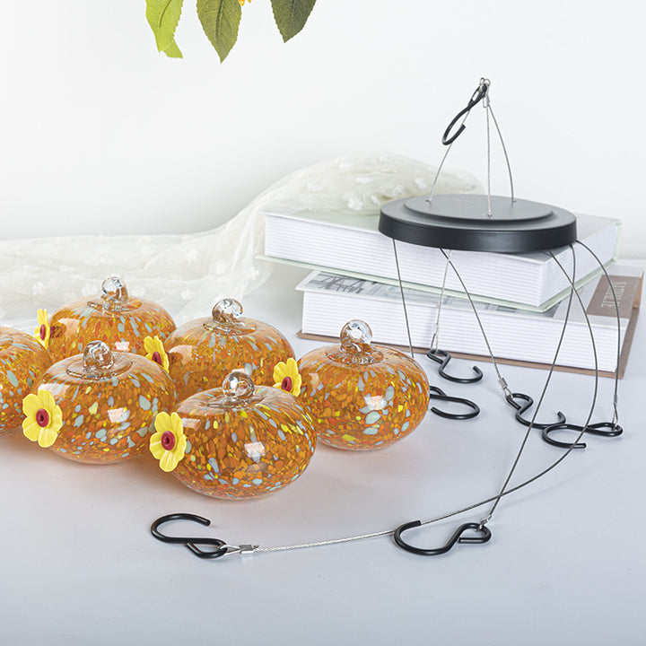 Hanging bird feeder and water station made of glass