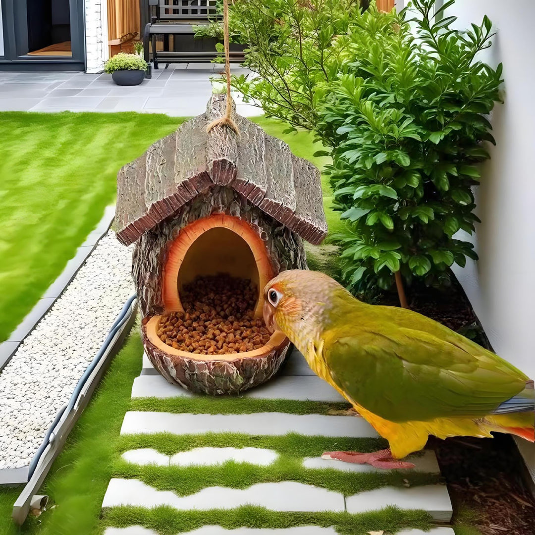 Decorative birdhouse in stump tree look made of resin