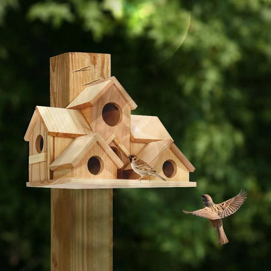 Wooden birdhouse in country house style for the garden