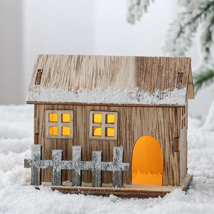Illuminated wooden Christmas house in Scandinavian style
