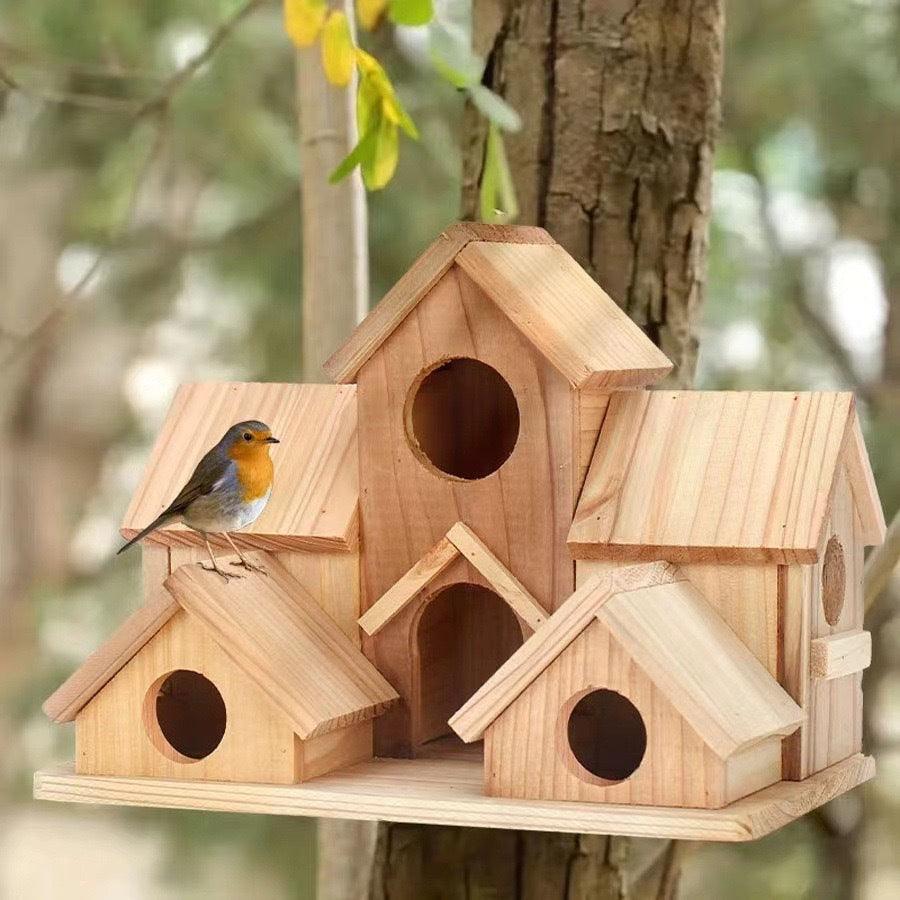 Wooden birdhouse in country house style for the garden