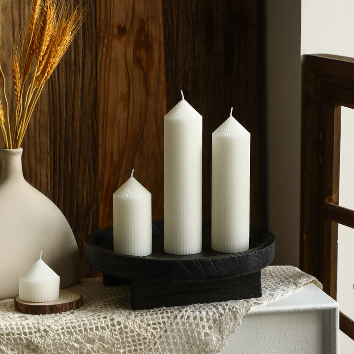 White tapered candle with striped pattern, Nordic