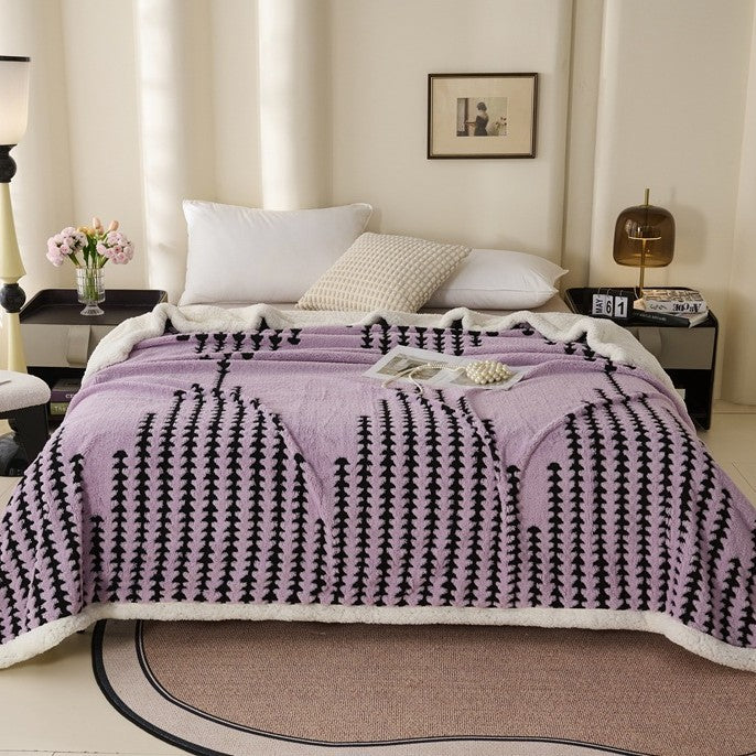 Double-layered throw blanket with lamb fleece look