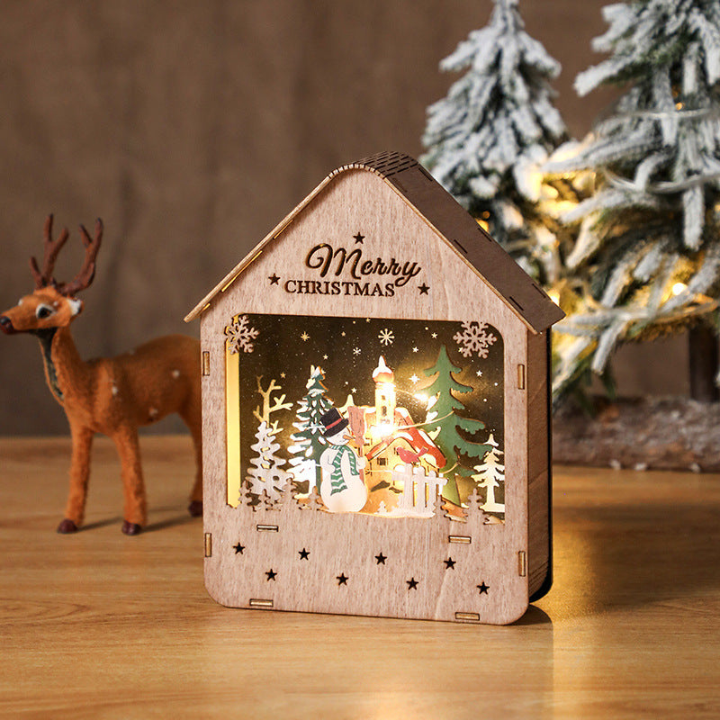 Illuminated wooden house with Christmas motif