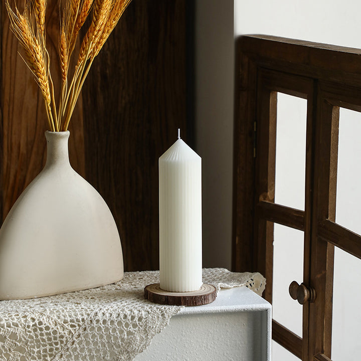 White tapered candle with striped pattern, Nordic