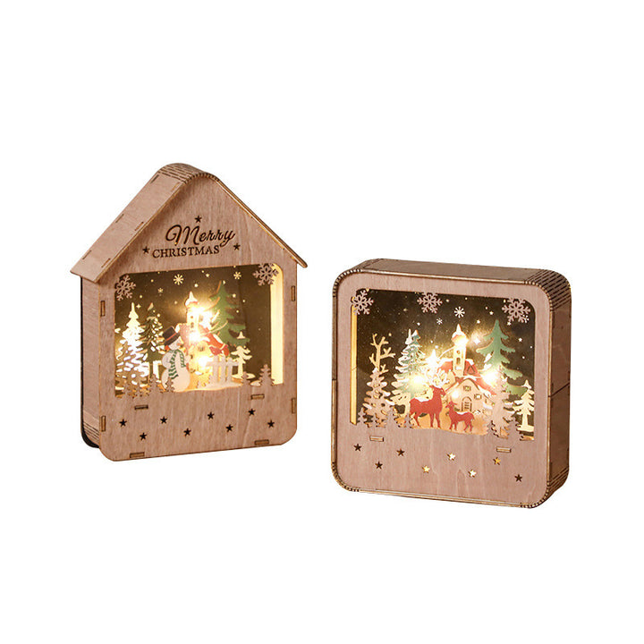 Illuminated wooden house with Christmas motif