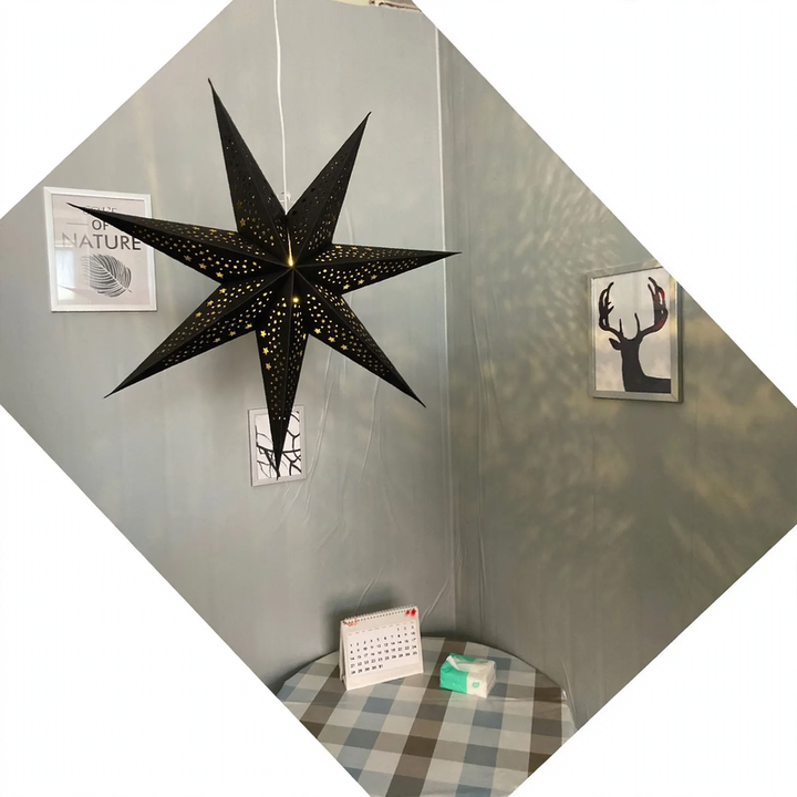 Decorative star pendant light made of parchment, iron frame
