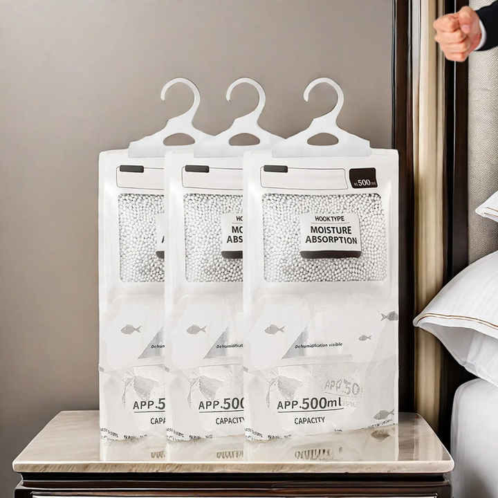 Hanging dehumidifying bag for wardrobes