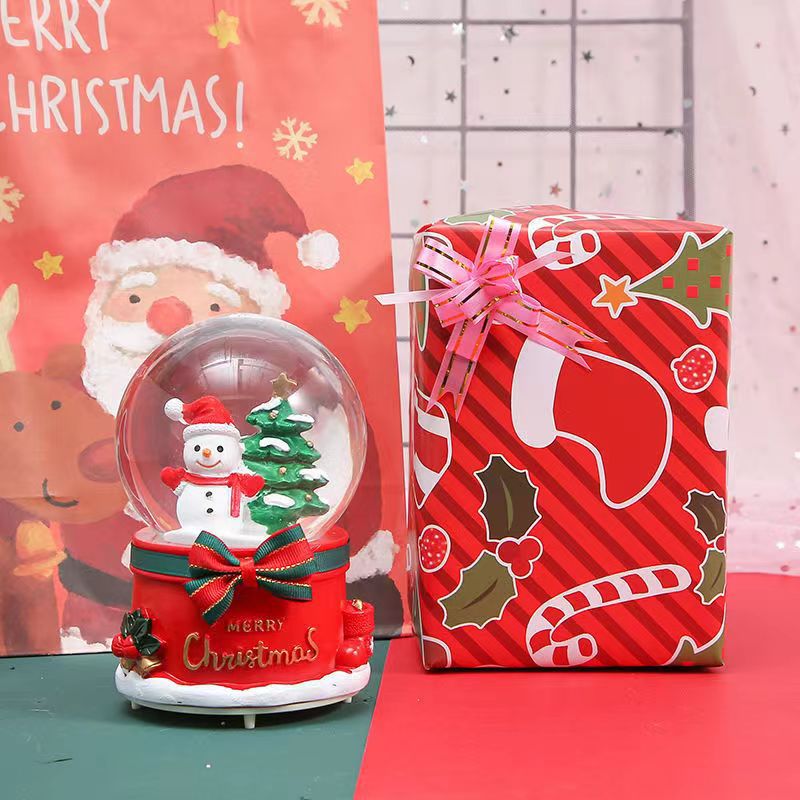Illuminated snow globe music box with music