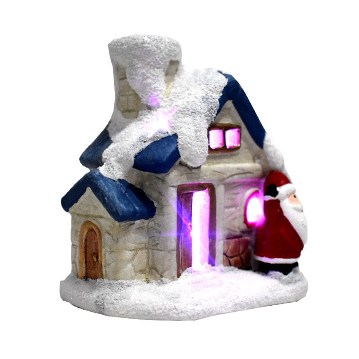 Illuminated Christmas house made of resin with snow effect
