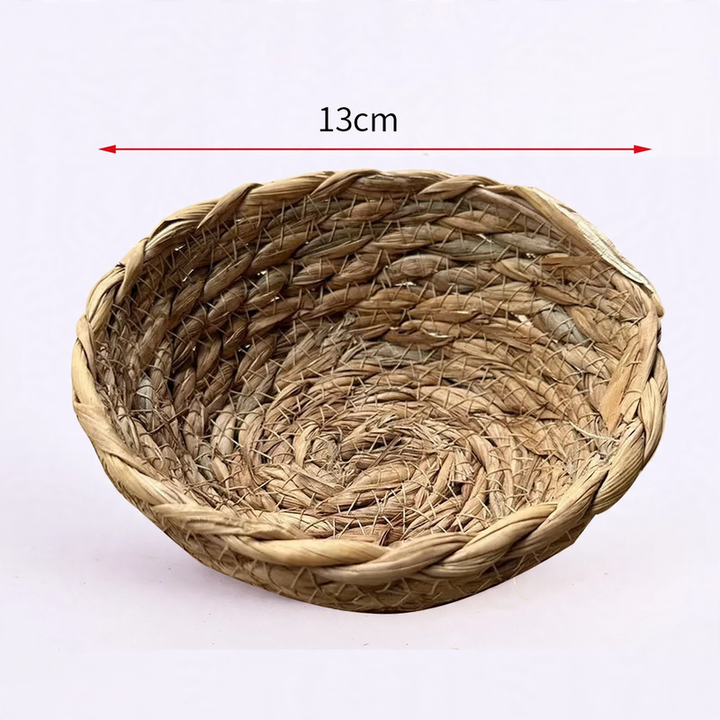 Braided birdhouse made of natural grass